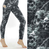 mock up of Monochrome skull leggings with swirling storm clouds and lightning bolts on a dark smoky background.
