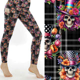 mockup of Dead Fancy Like Vintage-style skull leggings featuring fancy skeletons and brocade floral elements on a black and white plaid background by Nikki Whoops Boutique.