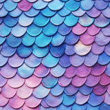 Close-up of blue and pink scale-patterned fabric