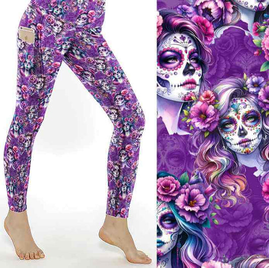 Mockup of Violet Femmes leggings. La Catrina images with flowing hair with tints of pink, mauve and blue. vibrant pink and purple flowers in their hair on a rich purple background by Nikki Whoops Boutique.
