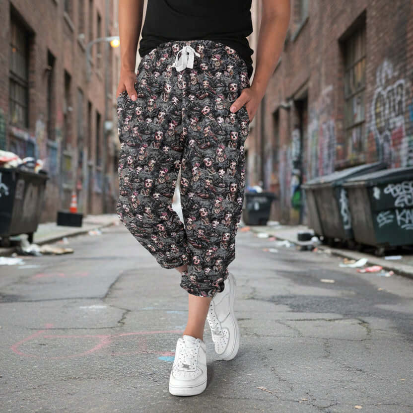 Person wearing floral-patterned pants on a light blue background