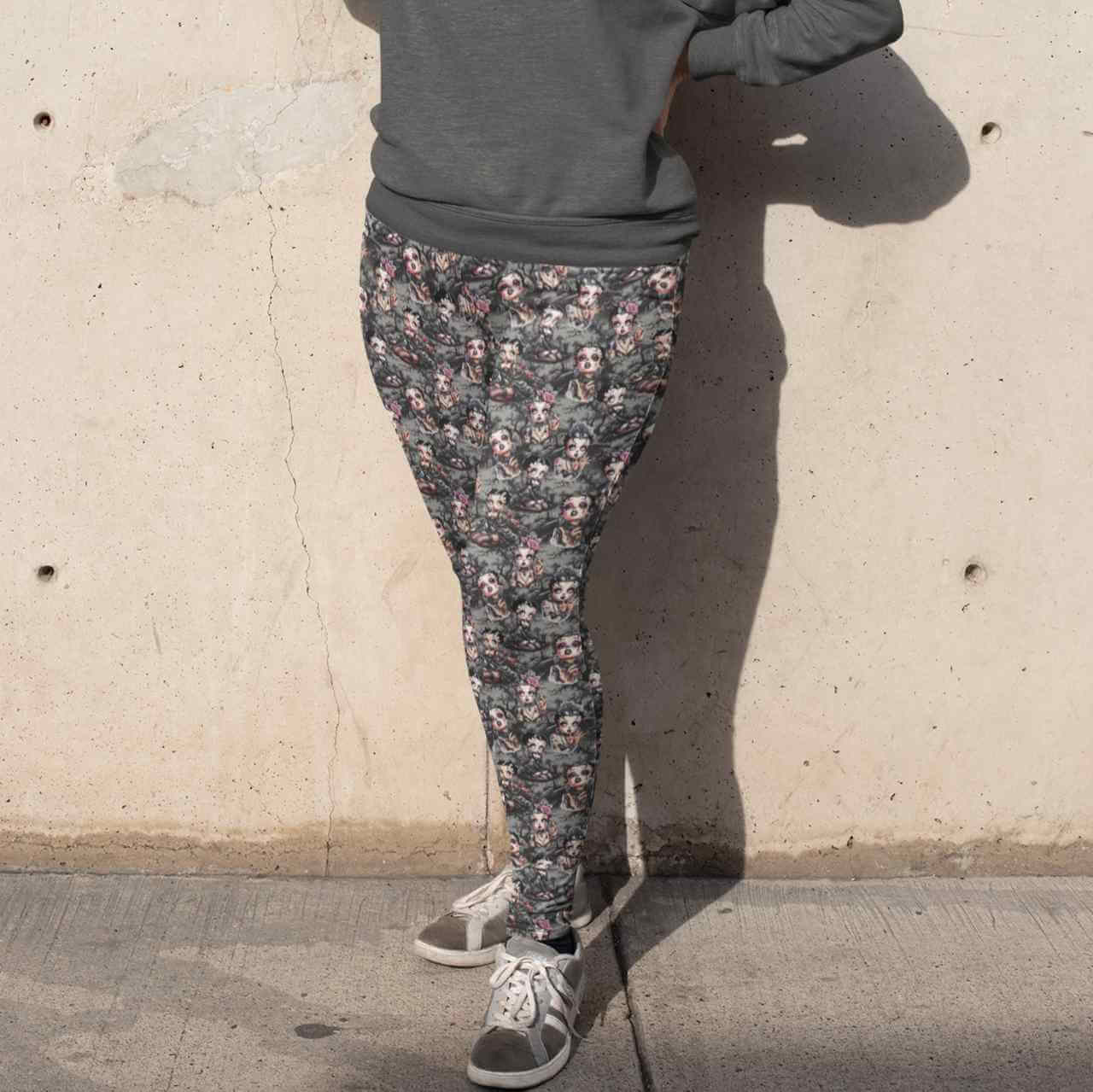 Black Betty Gothic Full-Length Leggings featuring a gothic-inspired Betty Boop in a foggy graveyard, dressed in lace and corsets with dark makeup. black-betty-leggings-mockup-of-a-woman-wearing-a-plus-size-sweatshirt-and-leggings-covering-her-face-from-the-sun-