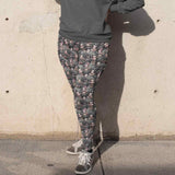 Black Betty Gothic Full-Length Leggings featuring a gothic-inspired Betty Boop in a foggy graveyard, dressed in lace and corsets with dark makeup. black-betty-leggings-mockup-of-a-woman-wearing-a-plus-size-sweatshirt-and-leggings-covering-her-face-from-the-sun-