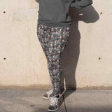 Black Betty Gothic Full-Length Leggings featuring a gothic-inspired Betty Boop in a foggy graveyard, dressed in lace and corsets with dark makeup. black-betty-leggings-mockup-of-a-woman-wearing-a-plus-size-sweatshirt-and-leggings-covering-her-face-from-the-sun-