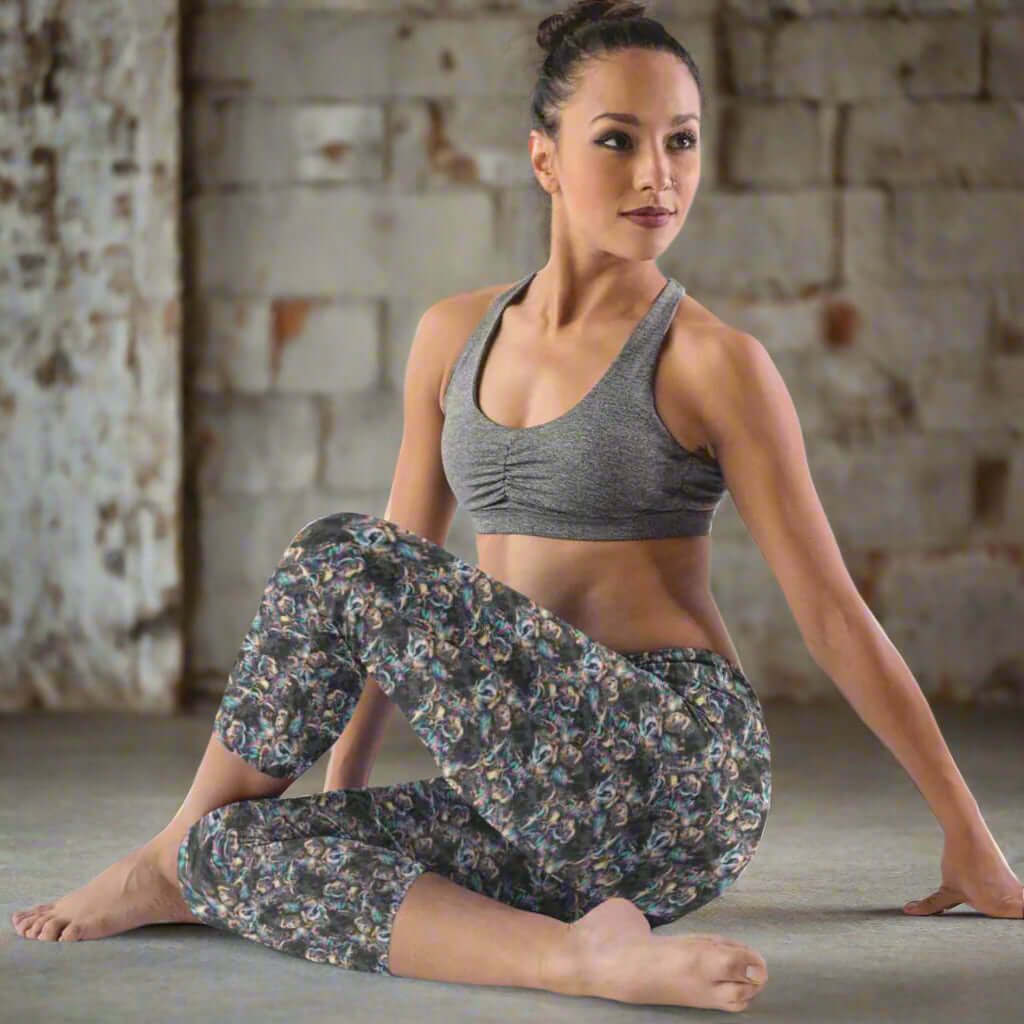 mock of lady wearing Fairy leggings with spell books, potions, moons and stars on a moody background with glittery accents.