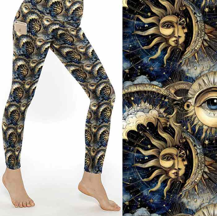 Celestial Secrets full-length leggings featuring celestial sun and moon faces, all-seeing eyes, stars and mystical astrology-inspired artwork in navy and gold tones.
