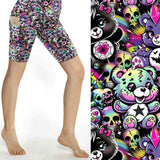 Colourful shorts featuring cute gothic bears, rainbow elements and skulls on a dark background