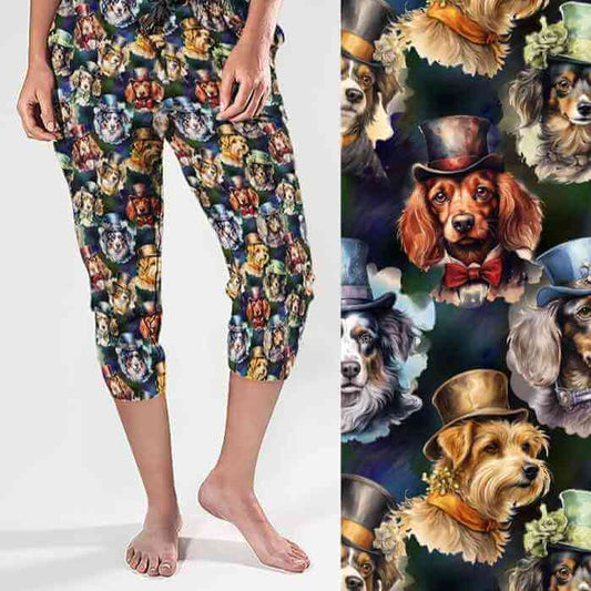 A pair of capri joggers featuring a colorful print of various dog breeds wearing hats and bow ties.