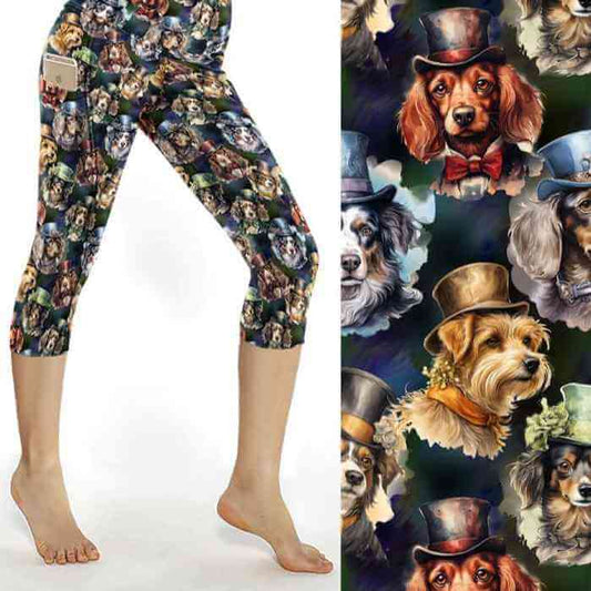 A pair of capri length leggings featuring a printed pattern with various dog breeds wearing top hats and bow ties on a dark green background. The leggings are showcased on a model who is standing in a pose that highlights the design and fit of the garment.