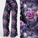 Diamonds and Pearls print lounge pants with purple roses, crystals and chandeliers on a deep violet background.