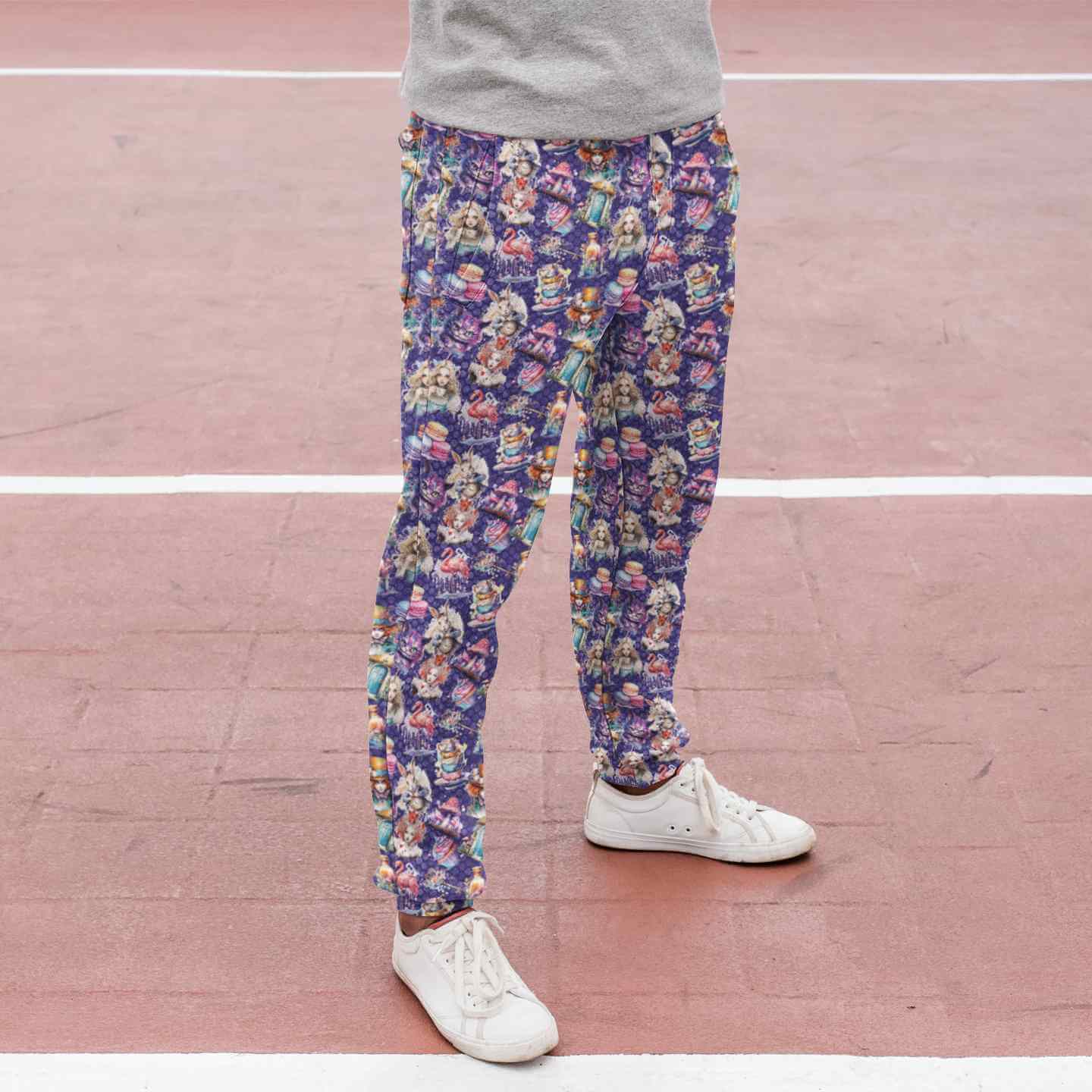 down-the-rabbit-hole-alice-in-wonderland-sublimated-sweatpants-mockup-featuring-a-woman-at-a-running-track-cropped