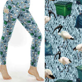 mockup of leggings featuring Australian ibis birds surrounded by garbage bins and bags on a blue diamond-patterned background.