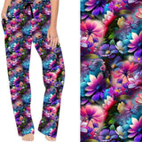 A pair of colorful lounge pants featuring a vibrant floral pattern with lotus flowers and cherry blossoms in shades of pink, purple, and blue.