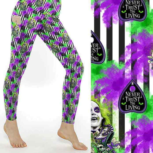 Leggings with green, purple, and black striped pattern, featuring Beetlejuice and text reading Never Trust the Living.