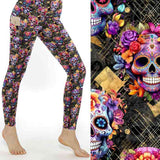 stock image of Lux de los Muertos Leggings bring bold sugar skulls and florals to life. A luxe Día de los Muertos print with serious attitude.