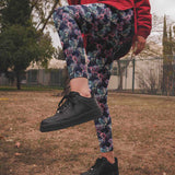 Person wearing black sneakers and colorful zombie pegasus pants in an outdoor setting in My Little Apocalypse - Zombie Pegasus Leggings by Nikki Whoops Boutique.