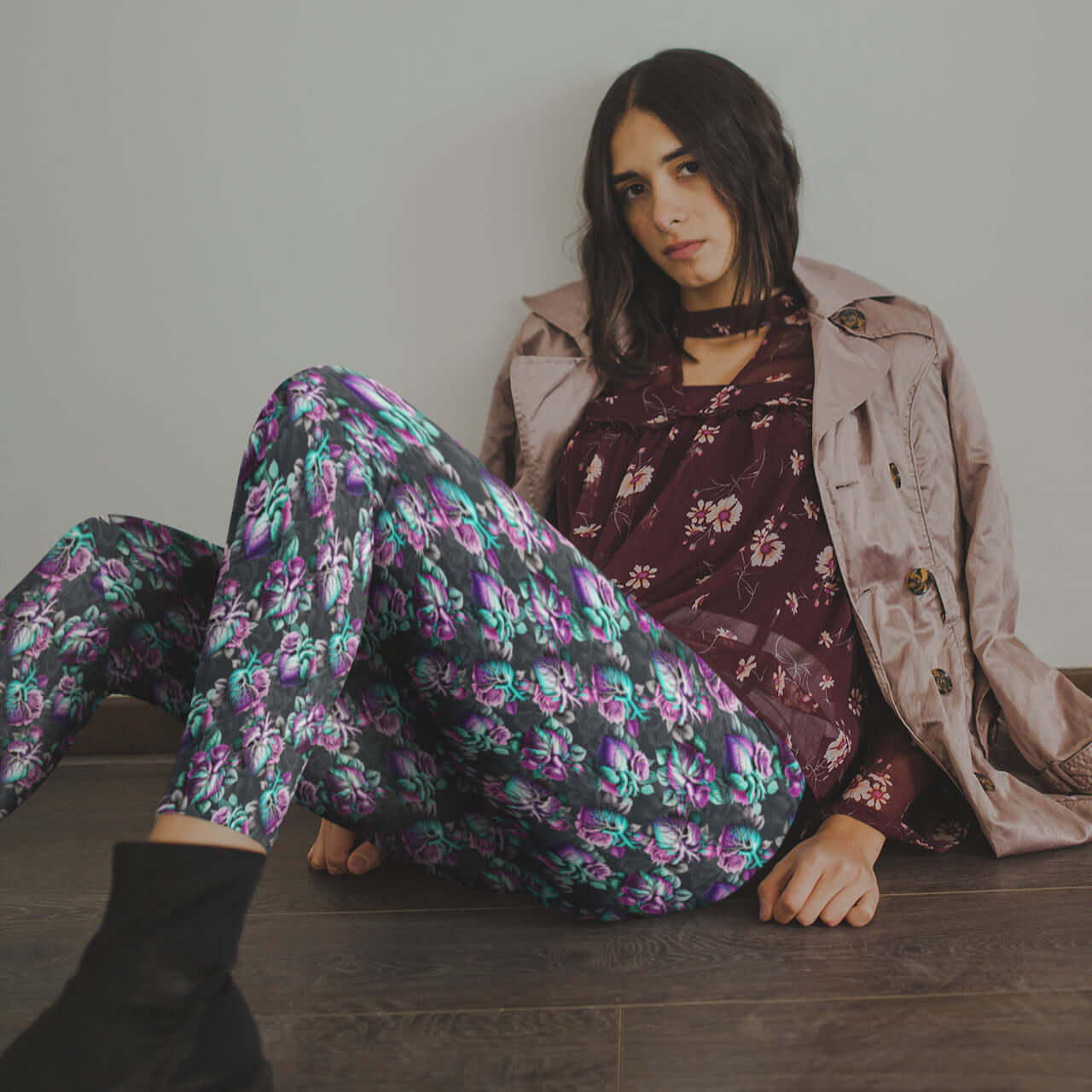 mockup of girl wearing Anatomical heart leggings featuring detailed hearts entwined with soft florals on a deep moody background.