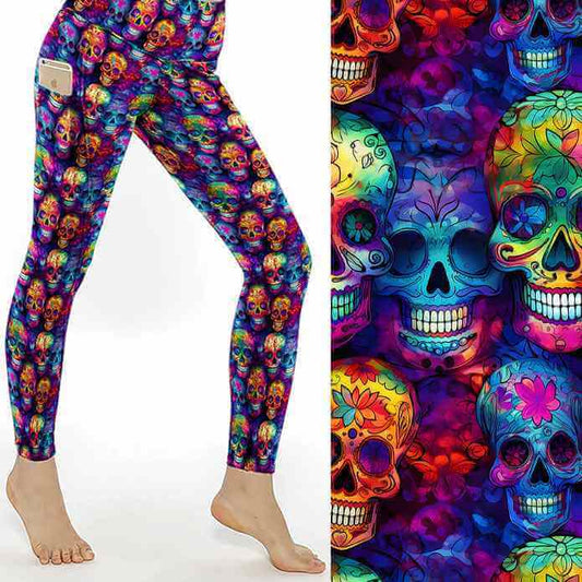 Bright rainbow coloured sugar skull pattern on black background, featuring vibrant Day of the Dead style skulls