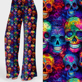 Women's colourful skull print lounge pants featuring vibrant rainbow sugar skulls on a dark background.