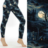 Sleepy Hollow Full-Length Leggings featuring moonlit cottages, dark forests, glowing windows, twisted trees and atmospheric gothic landscape artwork.