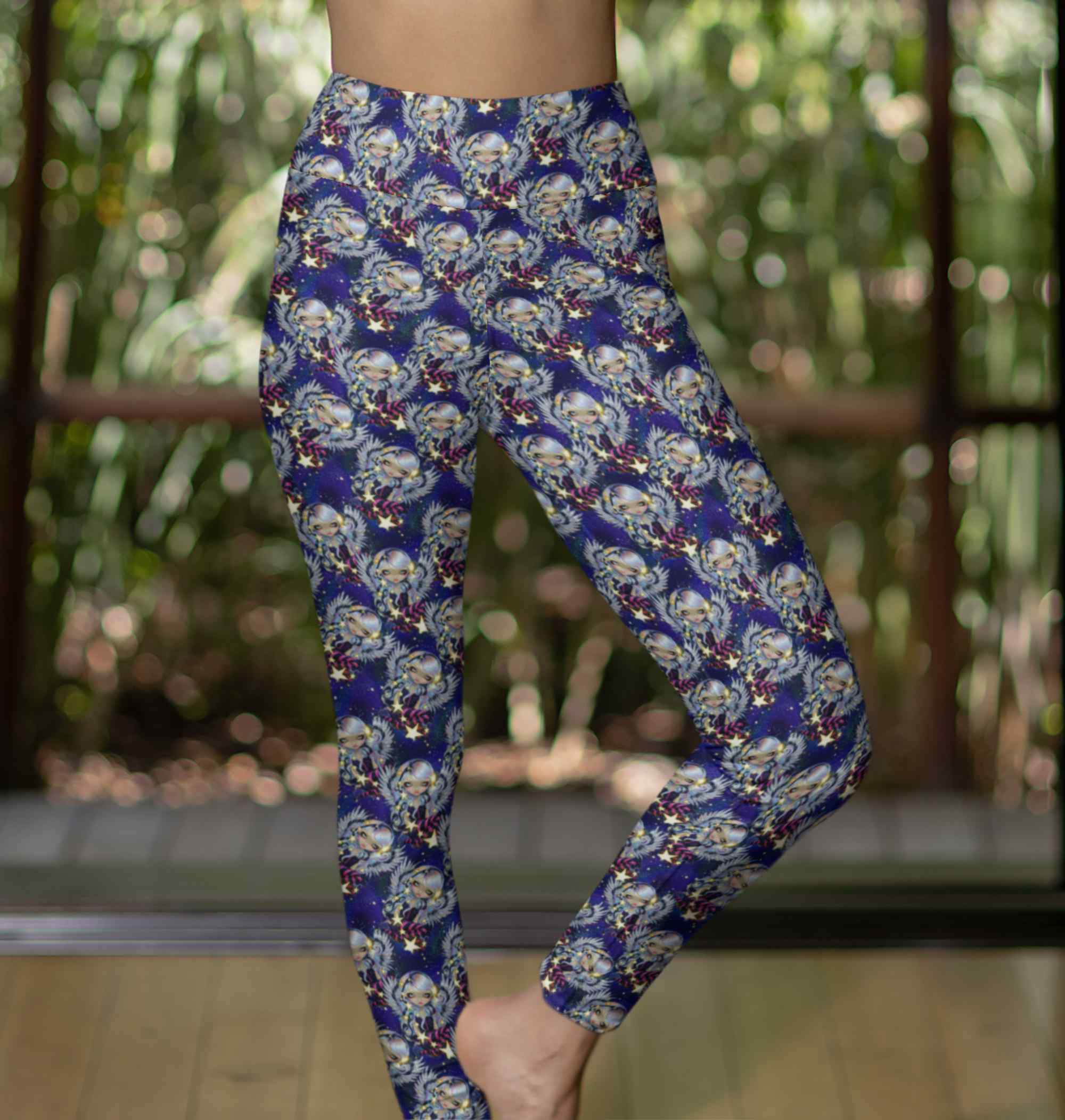 lady wearing Celestial leggings with silver-haired angels, glowing stars and a deep galaxy background in blues and purples.