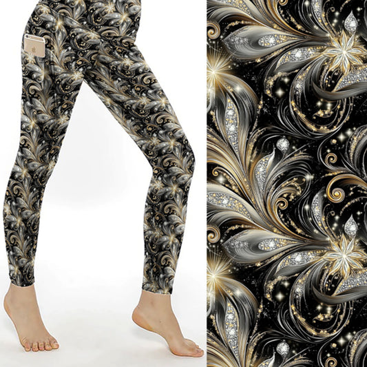 Leggings with intricate black and gold pattern on a white background