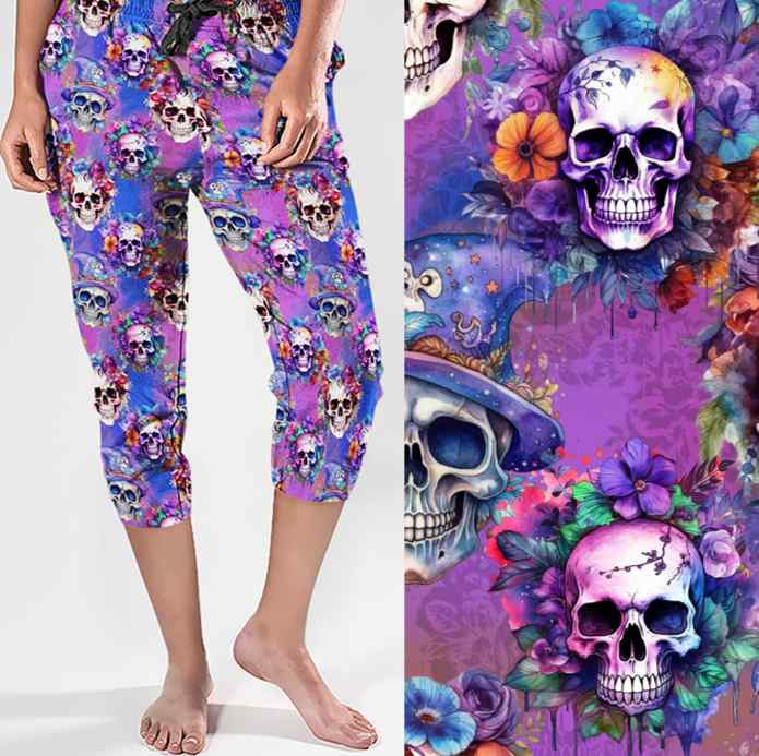 ladies jogger with smiling skulls and flowers on a vibrant blue and purple background