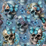 A repeating pattern featuring skulls adorned with pastel flowers and blue butterflies against a soft blue background. Each skull is decorated with different floral arrangements, and butterflies in varying sizes and shades of blue are seen perched on the skulls or flying around them, creating a whimsical and gothic aesthetic