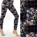 mockup of Leggings featuring gothic fairy illustrations with skulls, roses, and iridescent wings on a dark patterned background