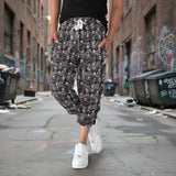 Person wearing floral-patterned pants on a light blue background