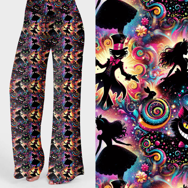 Wide leg lounge pants with vibrant Alice in Wonderland print featuring Cheshire Cat, Mad Hatter, Alice silhouettes, and colourful swirls.