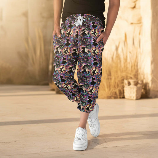Person wearing colorful Alice in Wonderland capri jogger pants outdoors in afternoon sunlight