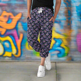 dance_of_the_sugar_plum_zombie_capri_jogger_sweatpants-mockup-featuring-a-woman-posing-in-a-studio-15608a