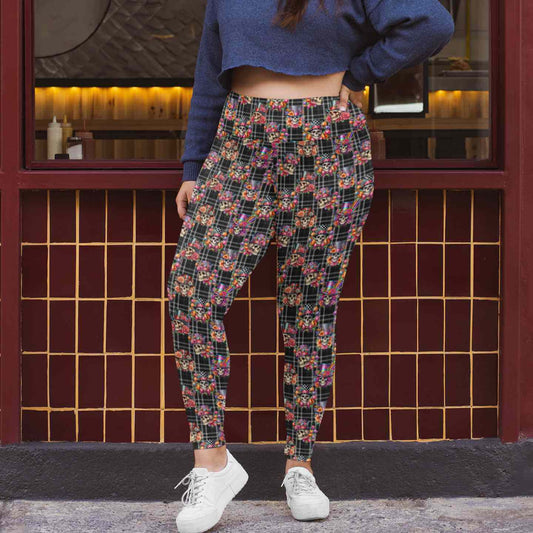 mockup of lady outside a building wearing Dead Fancy Like Vintage-style skull leggings featuring fancy skeletons and brocade floral elements on a black and white plaid background by Nikki Whoops Boutique.