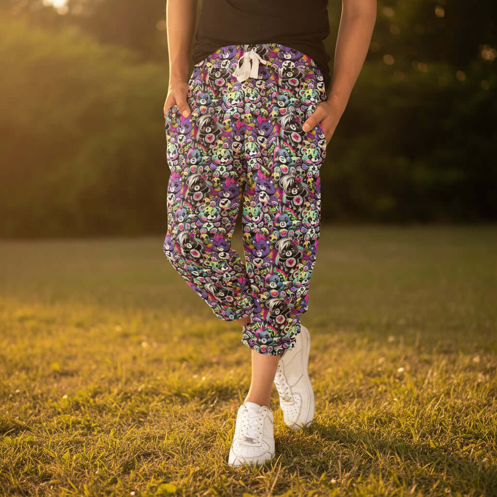 Person wearing colorful care bear capri jogger  pants outside in afternoon sunlight
