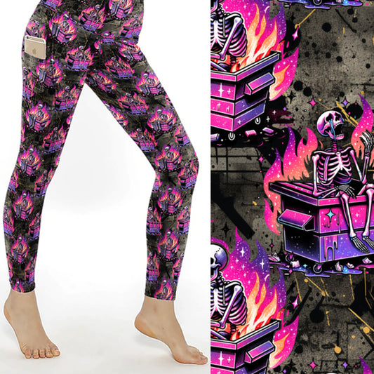 Black leggings with neon pink and purple skeletons sitting in flaming dumpsters on a grunge background.