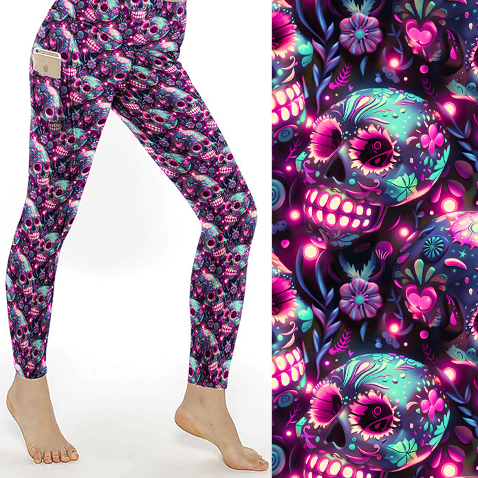 Electric Dreams Skull Print Leggings With Pockets featuring vibrant neon sugar skulls in pink, purple and turquoise on buttery-soft full-length leggings with side pockets.