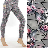 Fairy Gothmother Skull full length grey leggings with pink flowers, gothic fairy art, and skull designs on a geometric background by Nikki Whoops Boutique.