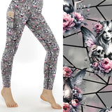 Grey leggings with pink flowers, gothic fairy art, and skull designs on a geometric background.