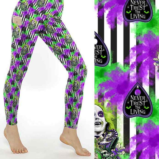 Leggings with green, purple, and black striped pattern, featuring Beetlejuice and text reading Never Trust the Living.