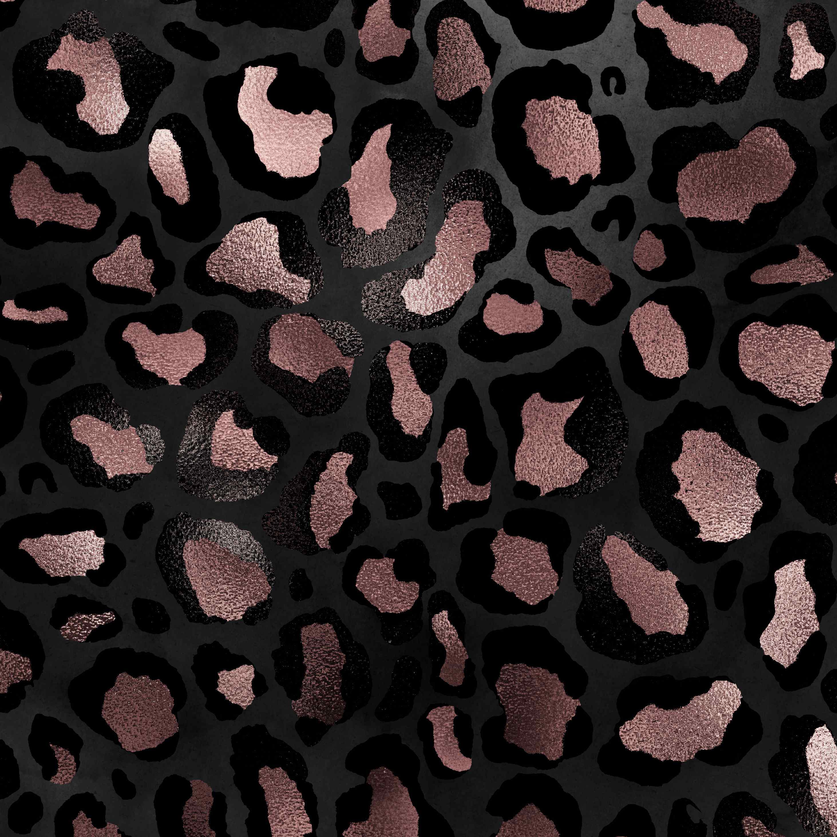 Close-up of a black and metallic rose gold leopard print pattern, showing the glossy texture and bold, irregularly shaped spots