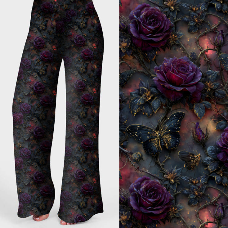 Women's gothic floral lounge pants featuring deep purple roses, black butterflies and dark botanical details on a moody background.