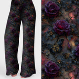 Women's gothic floral lounge pants featuring deep purple roses, black butterflies and dark botanical details on a moody background.