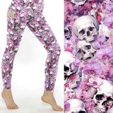 mock up of Gothic floral leggings with vintage skulls and pale pink and mauve flowers on a faded, distressed background.
