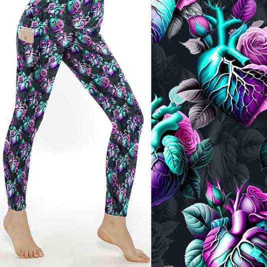 stock image of Anatomical heart leggings featuring detailed hearts entwined with soft florals on a deep moody background.