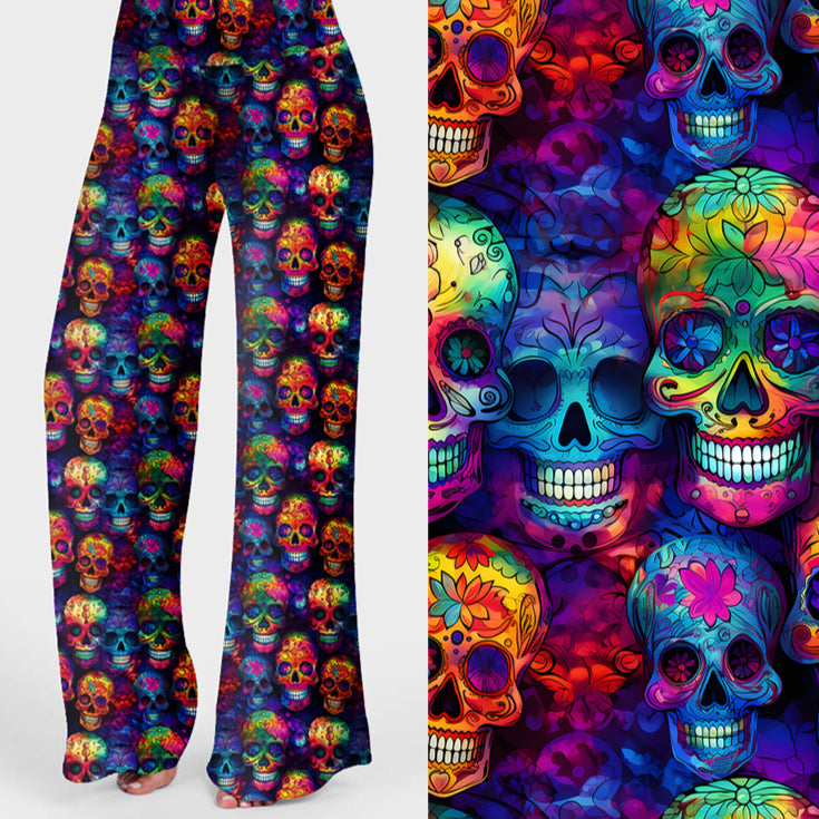 Women's colourful skull print lounge pants featuring vibrant rainbow sugar skulls on a dark background.