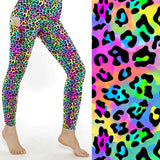Women's bright rainbow leopard print leggings with colourful animal spots and deep side pockets.