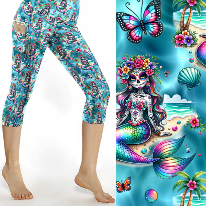 Capri leggings featuring swirling ocean-inspired patterns in shades of teal, blue, and silver with a shimmering underwater effect.