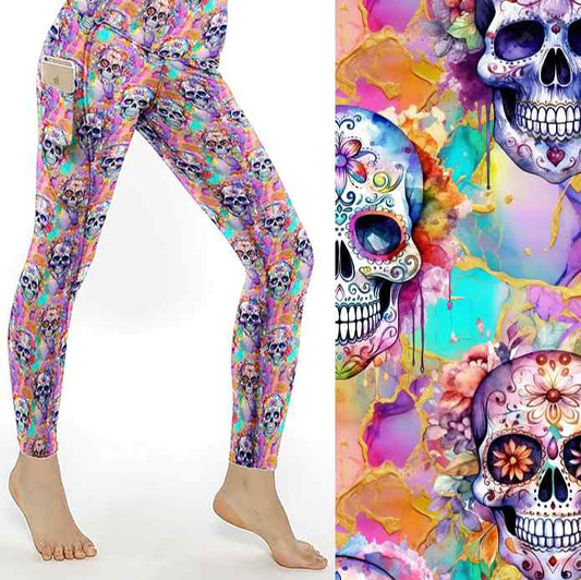 Sorbet Skulls leggings mockup. vibrant sugar skulls and flowers on a bright rainbow marbled background with hues of pink, purple, mint and gold. 