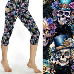 Steampunk souls capri leggings. steampunk skulls wearing flowers and top hats. Shades of pink, purple and turquoise on a distressed black background